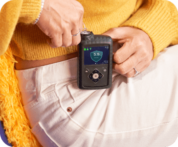 A healthcare device by medtronic clipped onto someone's pants.