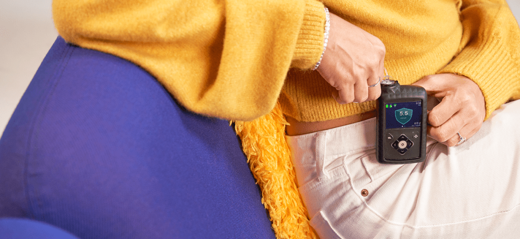 A healthcare device by medtronic clipped onto someone's pants.