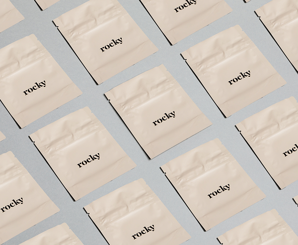 Beige packets of rocky on a grey background.