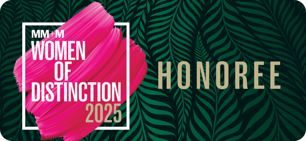 a stylized green leaf background with the text MM+M Women of Distinction 2025 on top in white lettering. The word Honoree is in big bold gold lettering.